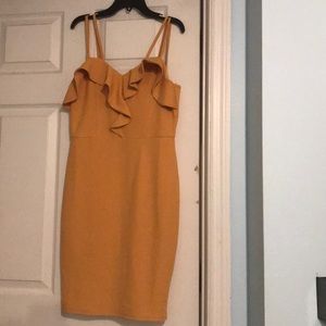 Yellow body con dress with ruffled neckline.